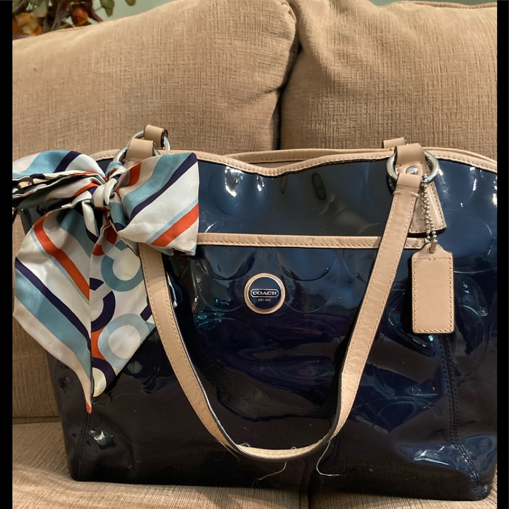 Coach blue patten leather with tan leather trim shoulder bag.